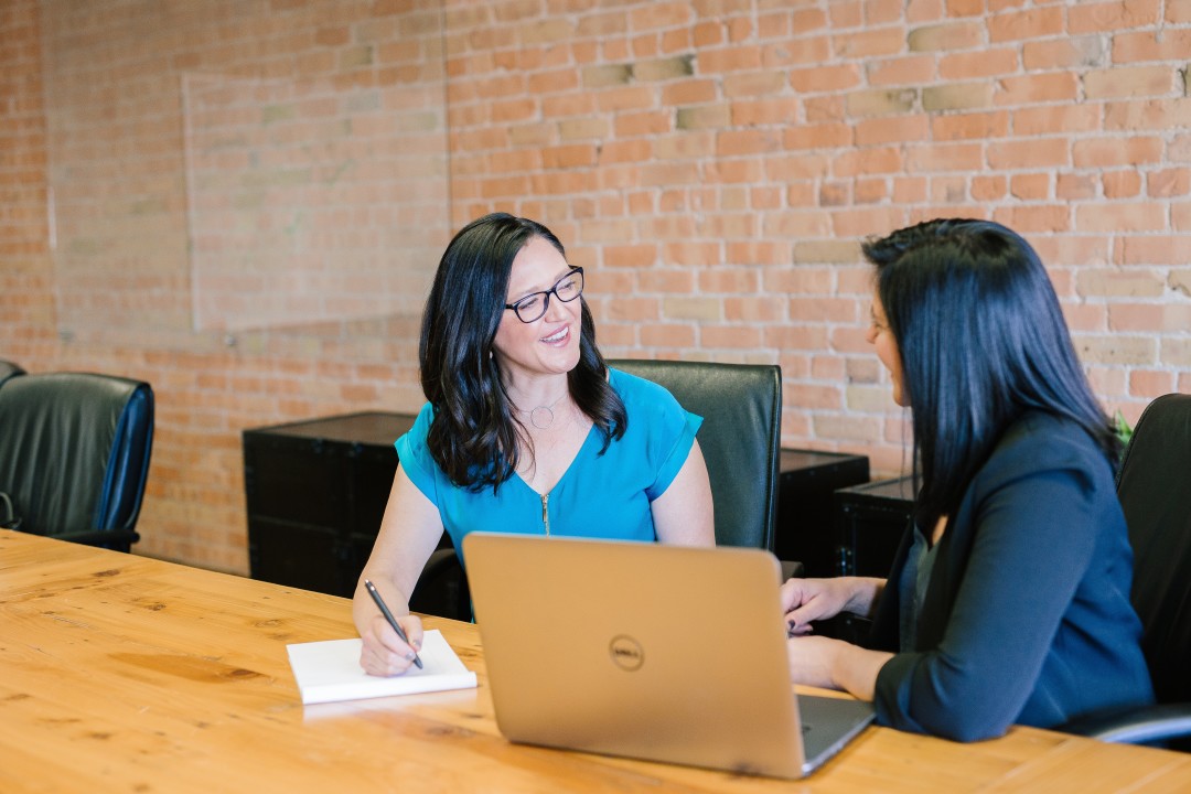 Woman supporting team member in workplace